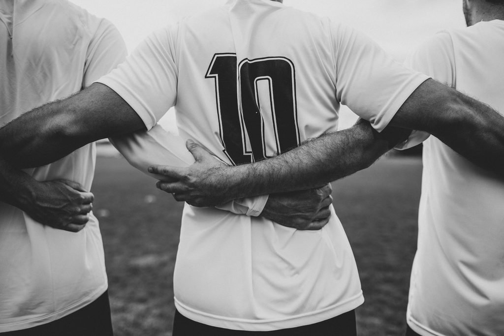 About Us football player wearing number 10 jersey