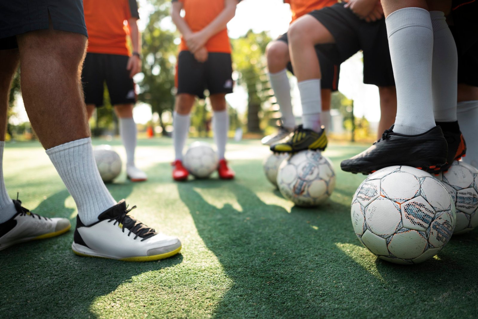 Home football trainer teaching his pupils
